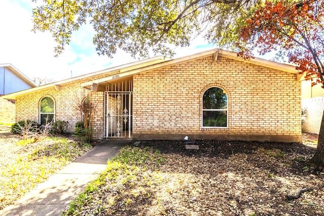 view of front facade featuring brick siding