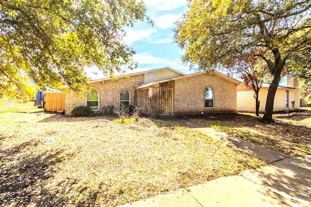 mid-century home with brick siding