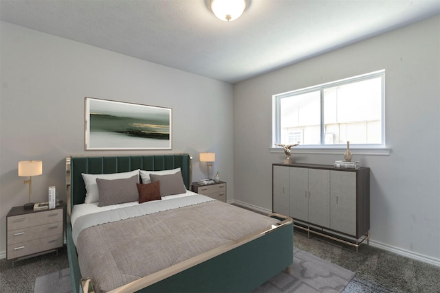 bedroom with carpet floors and baseboards