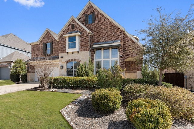 view of front of house with concrete driveway, stone siding, an attached garage, a front lawn, and brick siding