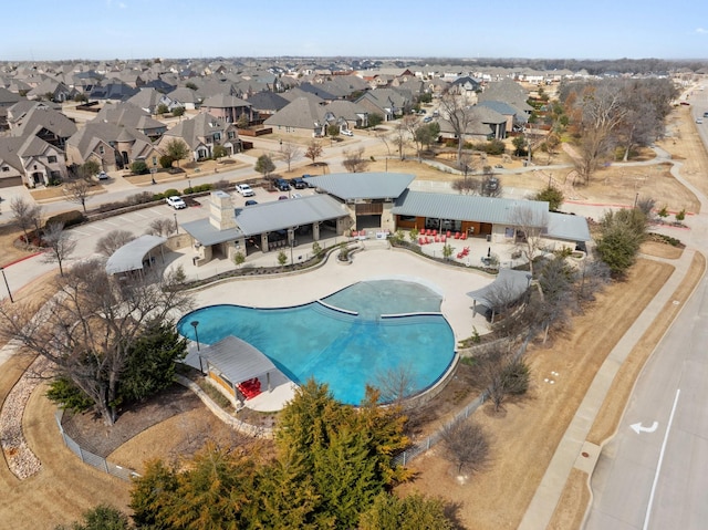 pool featuring a residential view and a patio