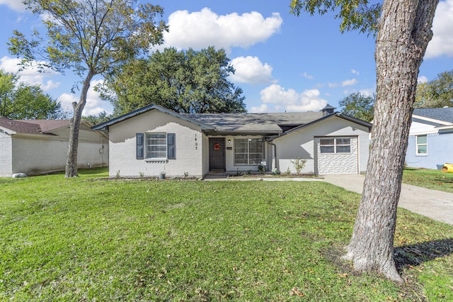 single story home with concrete driveway, a front lawn, and brick siding