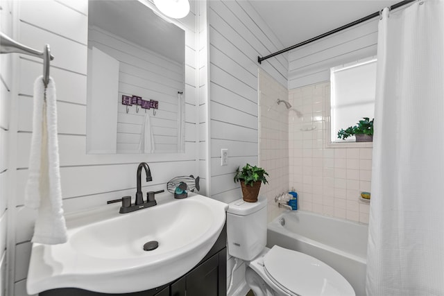 bathroom featuring toilet, shower / tub combo, and vanity