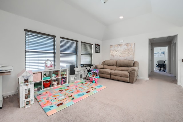 playroom with carpet floors, attic access, baseboards, and vaulted ceiling
