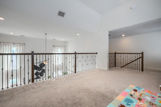 spare room with carpet, visible vents, baseboards, and recessed lighting