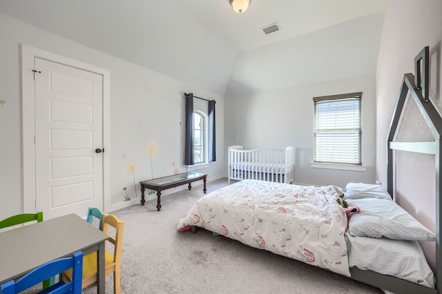 bedroom with lofted ceiling, multiple windows, carpet flooring, and visible vents