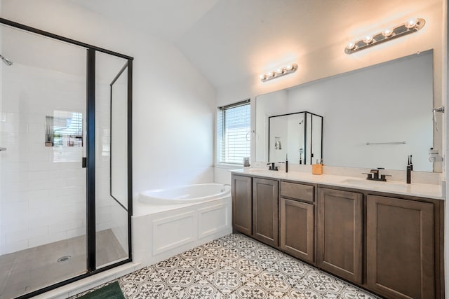 full bath featuring vaulted ceiling, a sink, a bath, and a shower stall