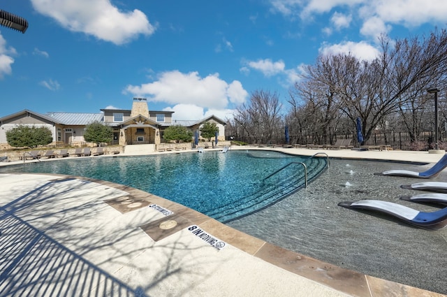 community pool featuring a patio area