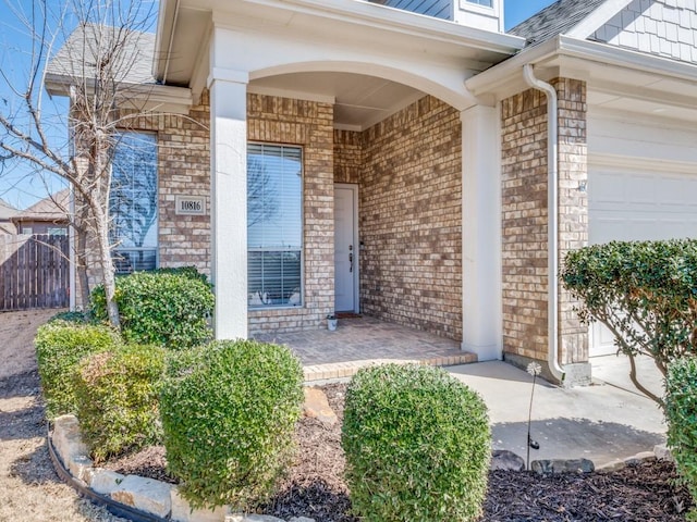 property entrance with brick siding