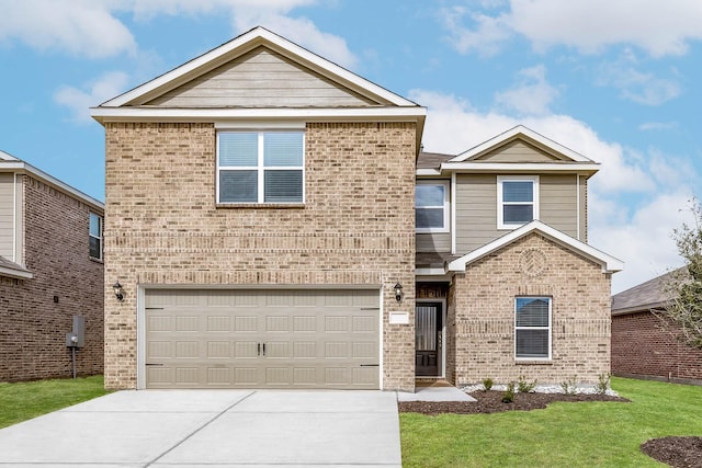 traditional home with concrete driveway, brick siding, and a front yard