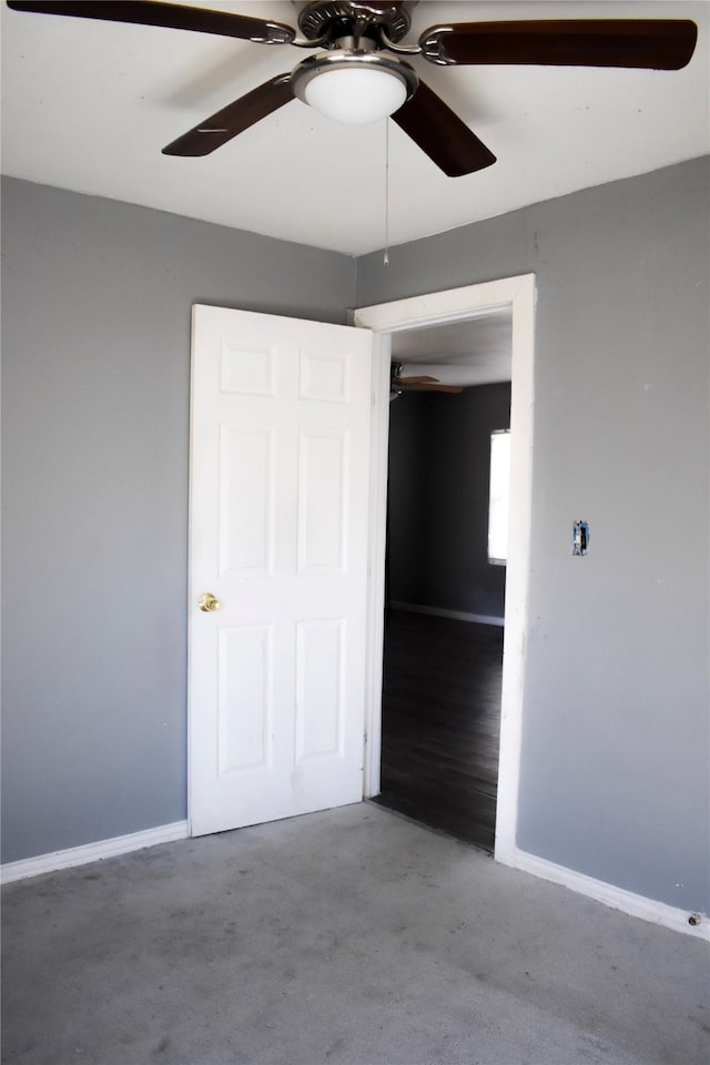 unfurnished bedroom featuring ceiling fan and baseboards