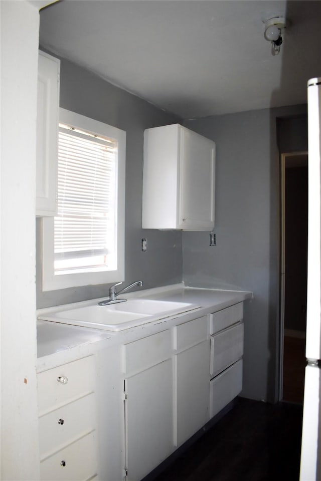 kitchen featuring light countertops and white cabinetry