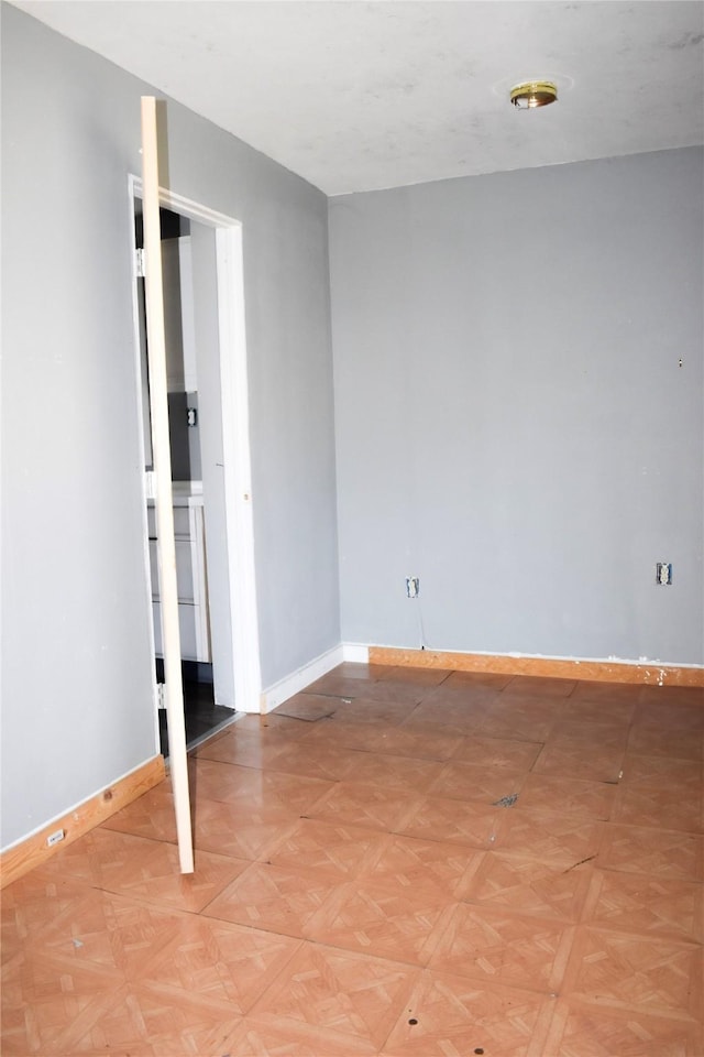 unfurnished bedroom featuring baseboards