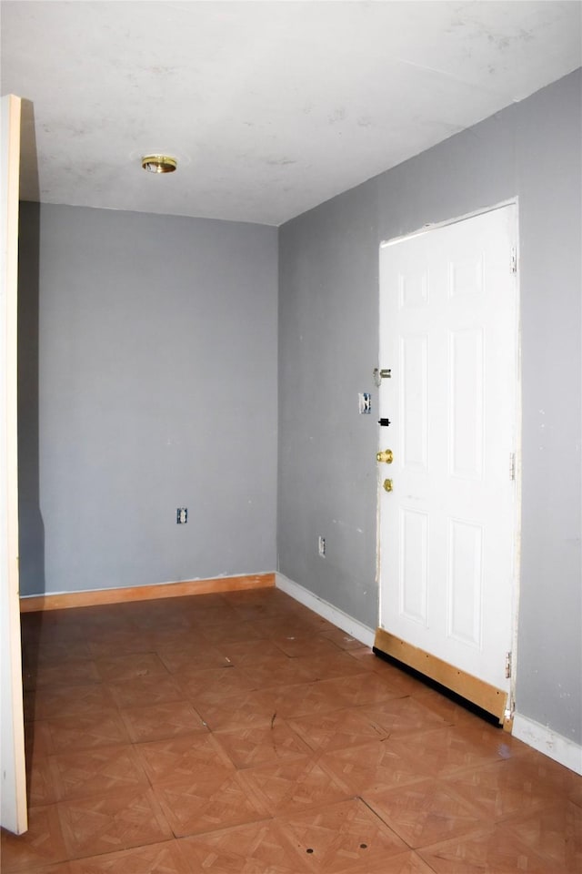 entrance foyer featuring baseboards