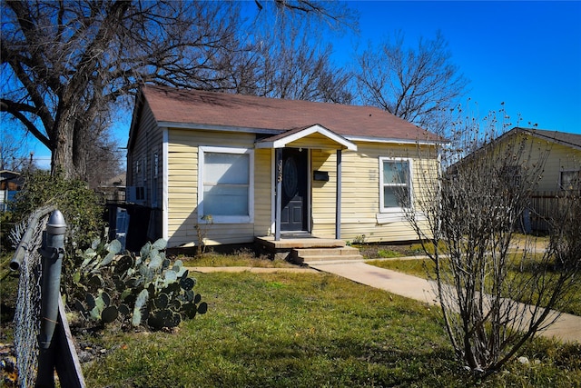 bungalow with a front yard