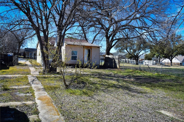 view of yard with a residential view and fence