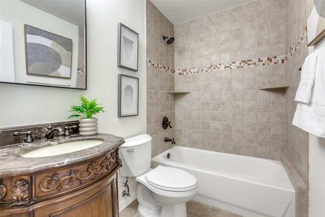 full bathroom featuring washtub / shower combination, vanity, tile patterned flooring, and toilet