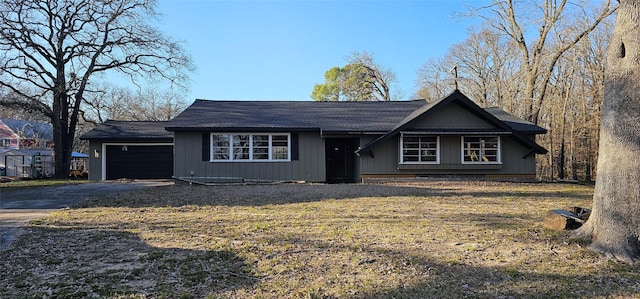 view of front of property with aphalt driveway and an attached garage