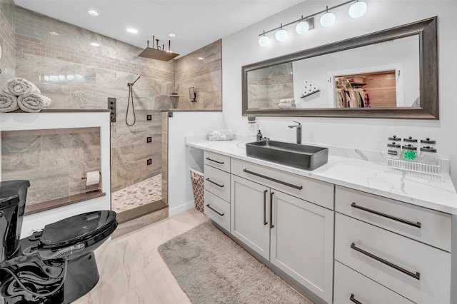 full bath with marble finish floor, recessed lighting, walk in shower, and vanity