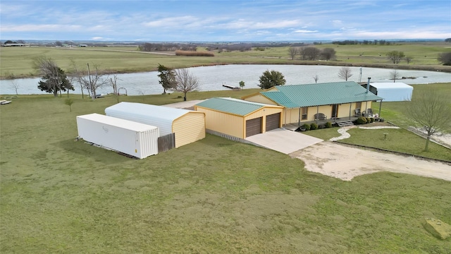 drone / aerial view featuring a water view and a rural view