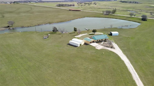 drone / aerial view with a water view and a rural view