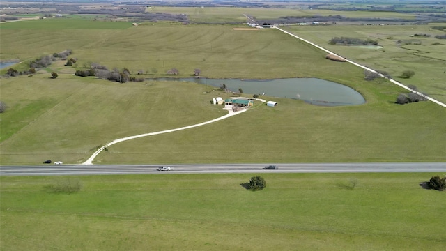 aerial view with a rural view and a water view