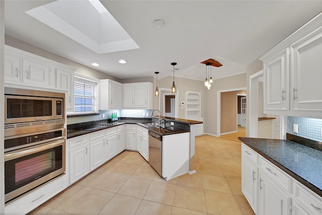 kitchen featuring light tile patterned floors, a peninsula, white cabinets, appliances with stainless steel finishes, and pendant lighting