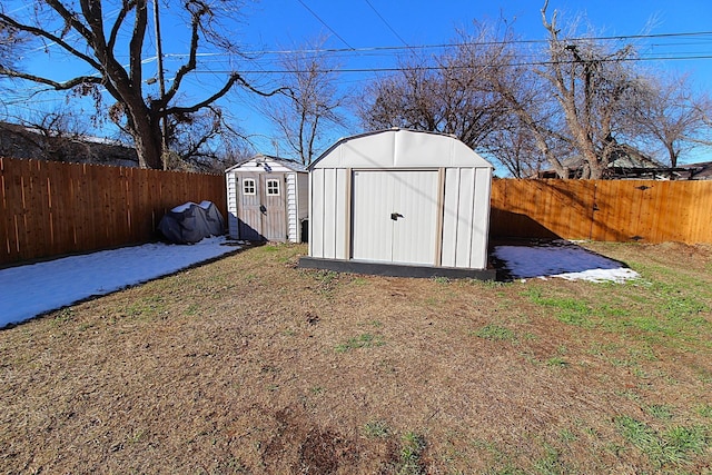 view of shed featuring a fenced backyard