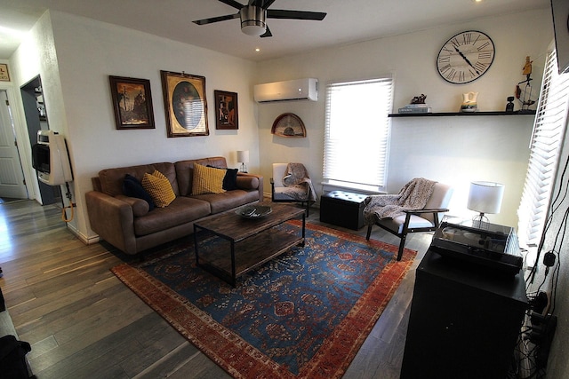 living room with ceiling fan, an AC wall unit, hardwood / wood-style flooring, and heating unit