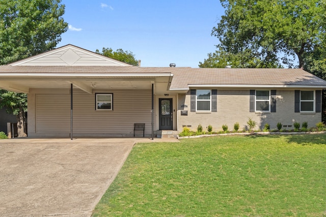 ranch-style house with an attached carport, brick siding, concrete driveway, crawl space, and a front lawn