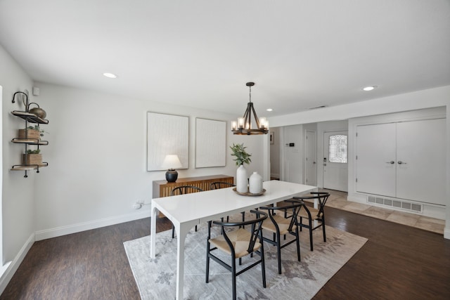 dining room featuring recessed lighting, wood finished floors, visible vents, and baseboards