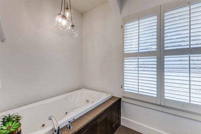 bathroom featuring a tub with jets