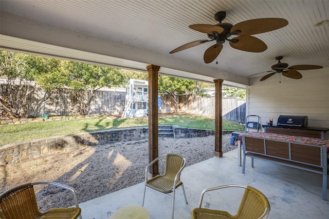 view of patio / terrace with a fenced backyard and a ceiling fan