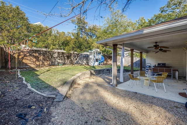 view of yard featuring a patio, a fenced backyard, and a ceiling fan