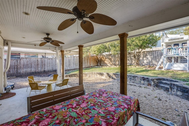 view of patio with a fenced backyard and ceiling fan