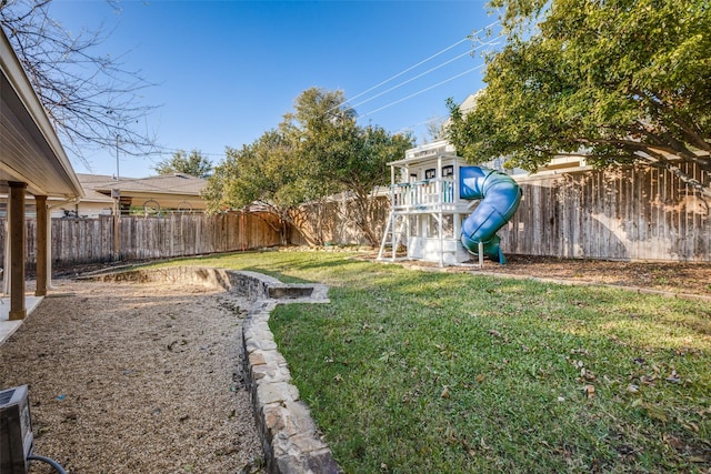 view of yard with a playground and a fenced backyard