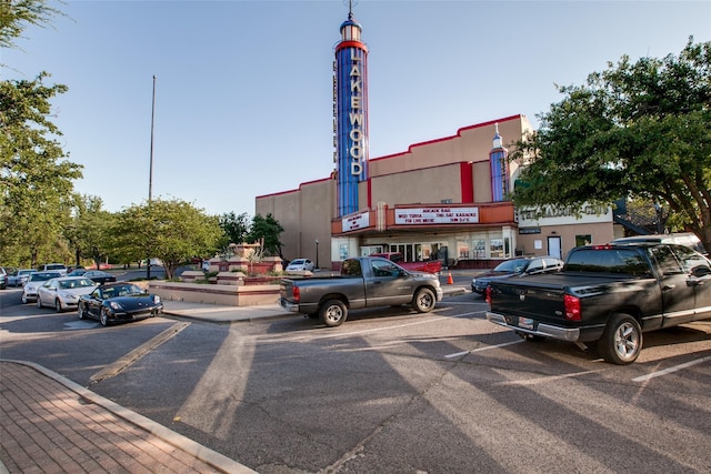 view of property featuring uncovered parking