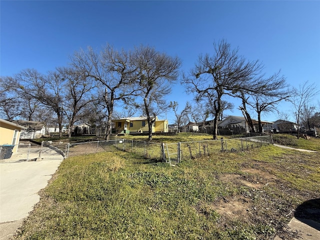 view of yard featuring a residential view and fence