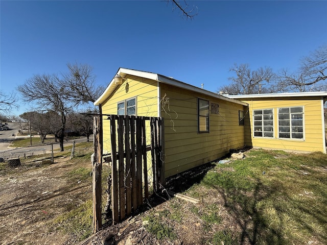 view of property exterior with fence