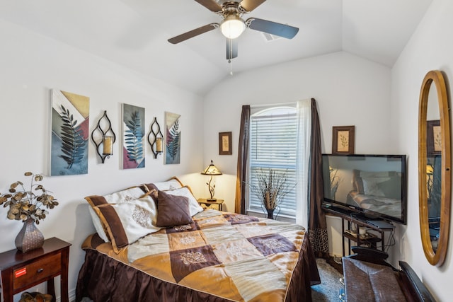 bedroom with carpet floors, lofted ceiling, and ceiling fan