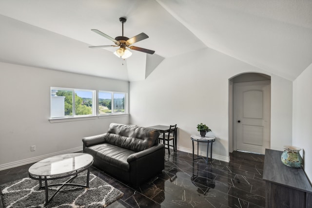 living room with lofted ceiling, marble finish floor, baseboards, and arched walkways