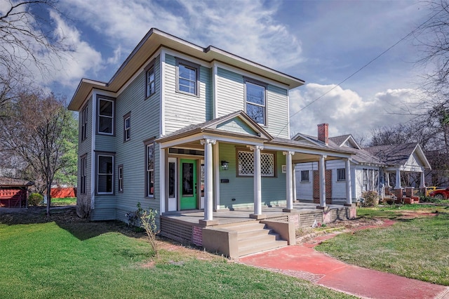 view of front of property featuring a front lawn and a porch