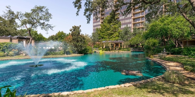 view of swimming pool with a water view