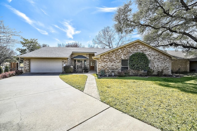 view of front of property with a garage, brick siding, concrete driveway, and a front yard