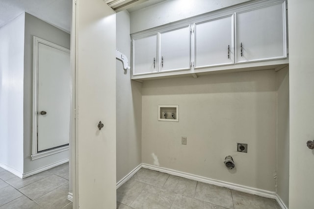 laundry area featuring light tile patterned floors, washer hookup, cabinet space, and electric dryer hookup