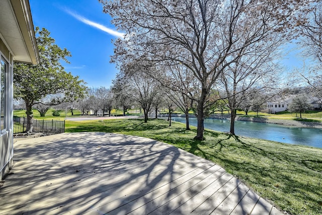 exterior space with a yard and a water view