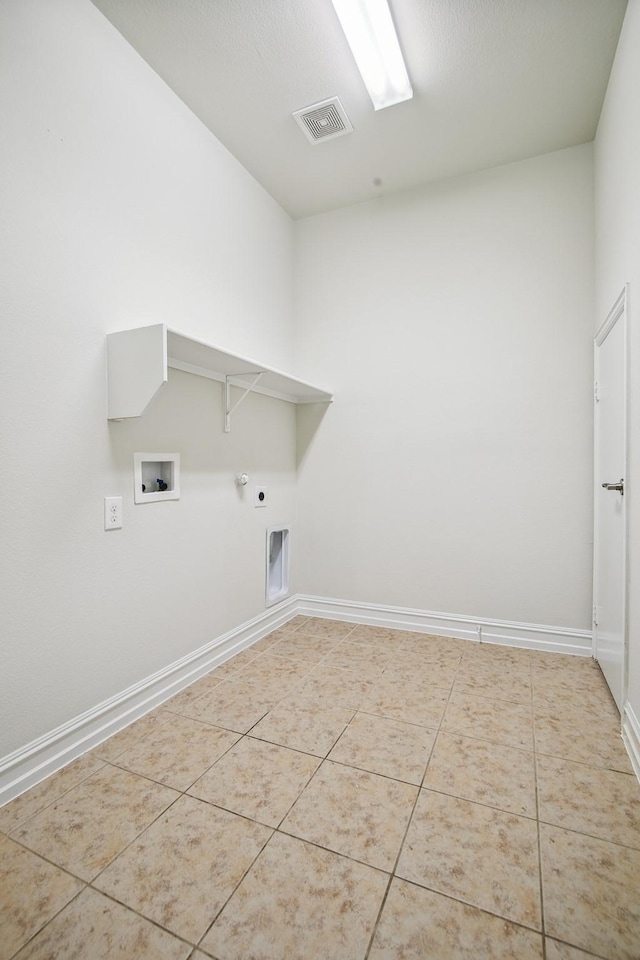 washroom with hookup for a washing machine, visible vents, gas dryer hookup, tile patterned flooring, and laundry area