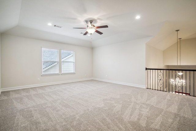 carpeted empty room with vaulted ceiling, recessed lighting, visible vents, and baseboards