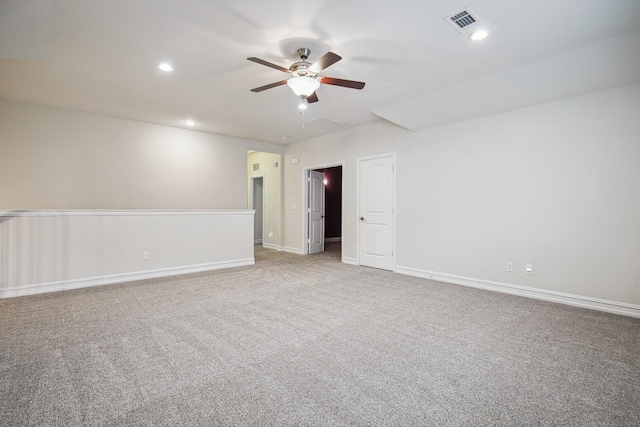 spare room featuring baseboards, visible vents, carpet flooring, and recessed lighting