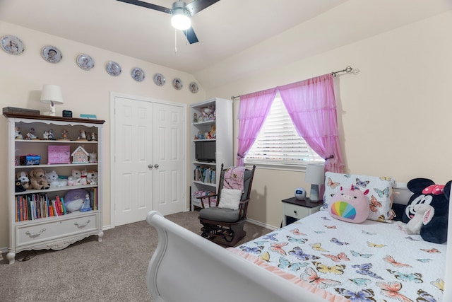 bedroom featuring ceiling fan, vaulted ceiling, a closet, and light colored carpet